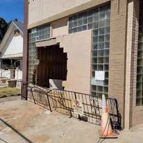 There is a hole in the side of a building.