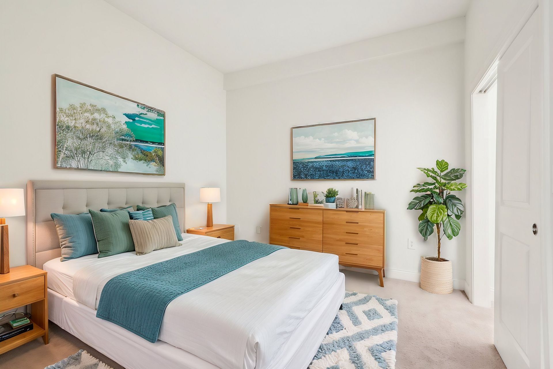 A bedroom with a large bed and a dresser.