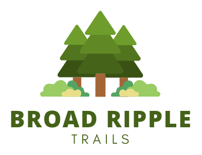 A logo for broad ripple trails with three pine trees