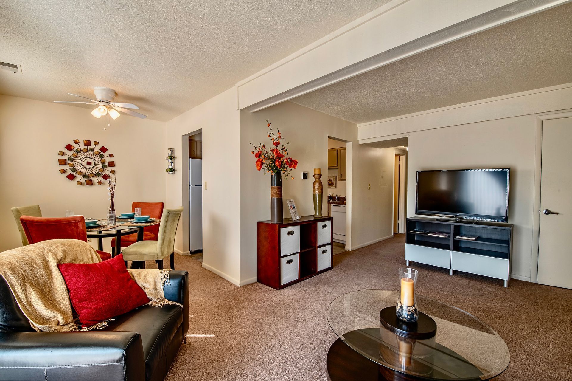 A living room filled with furniture and a flat screen tv