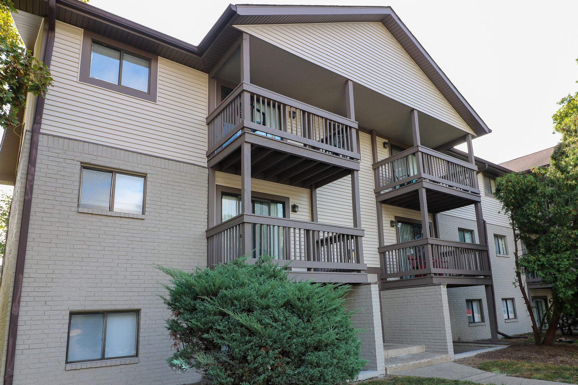 A large apartment building with a lot of windows and balconies