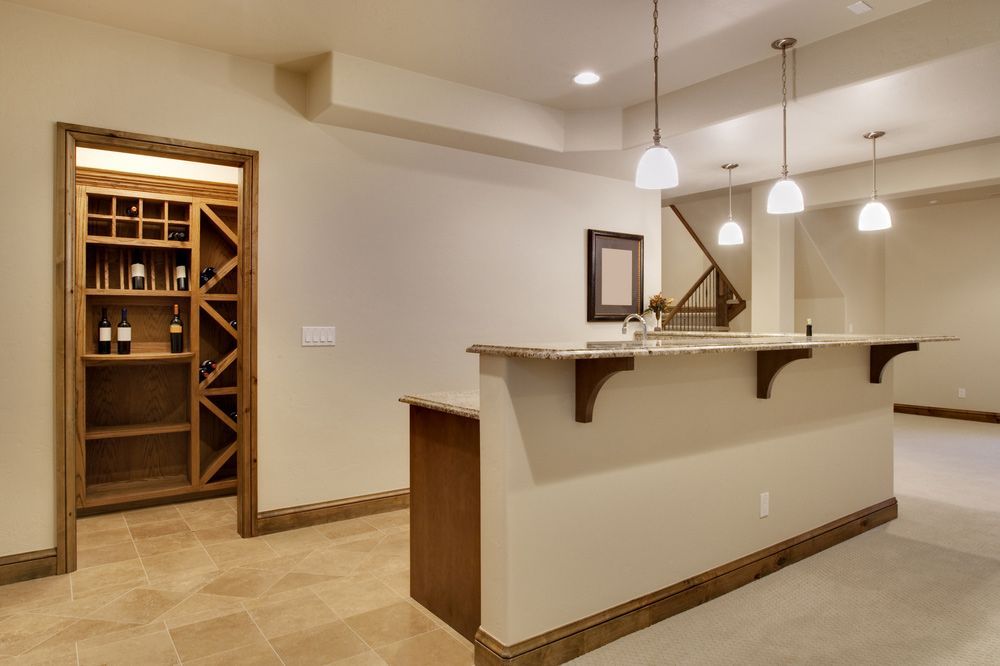 A Basement With A Bar And A Wine Cellar — Universal Marble & Granite In Logan, QLD