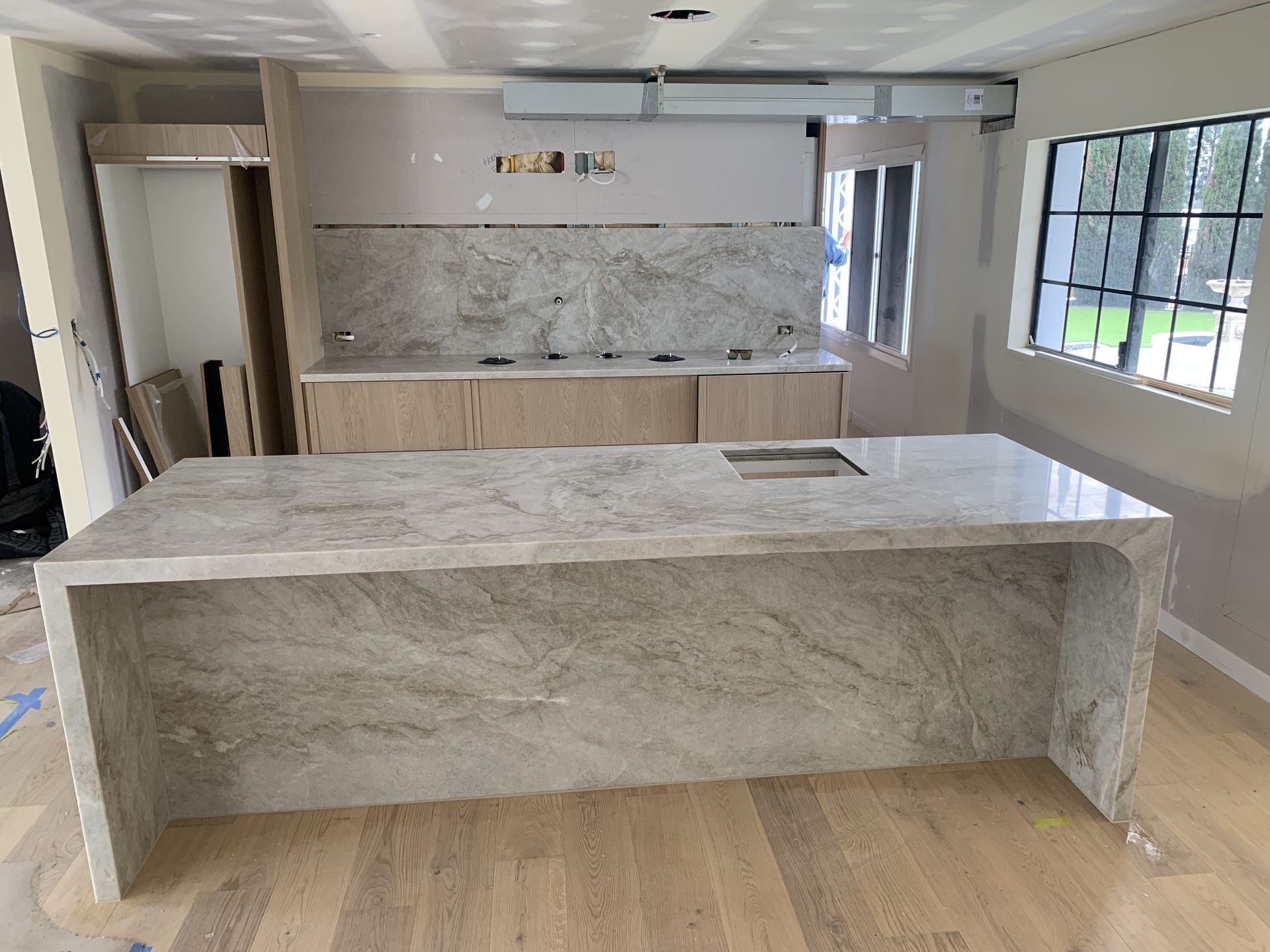 A large marble kitchen top in a new build home — Universal Marble & Granite In Woolgoolga, NSW