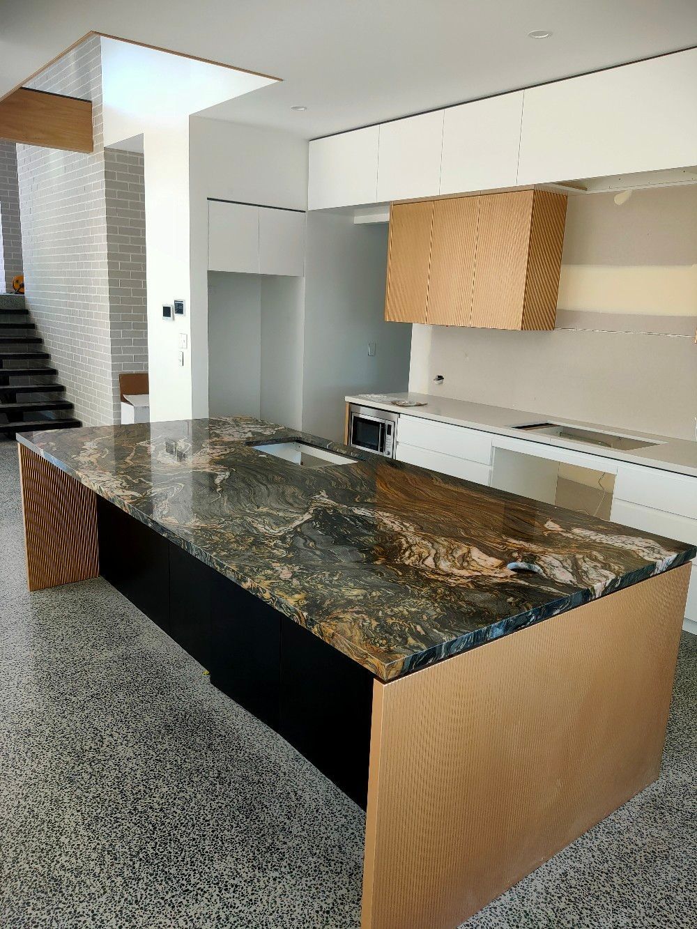 A huge marble benchtop in kitchen space — Universal Marble & Granite In Woolgoolga, NSW