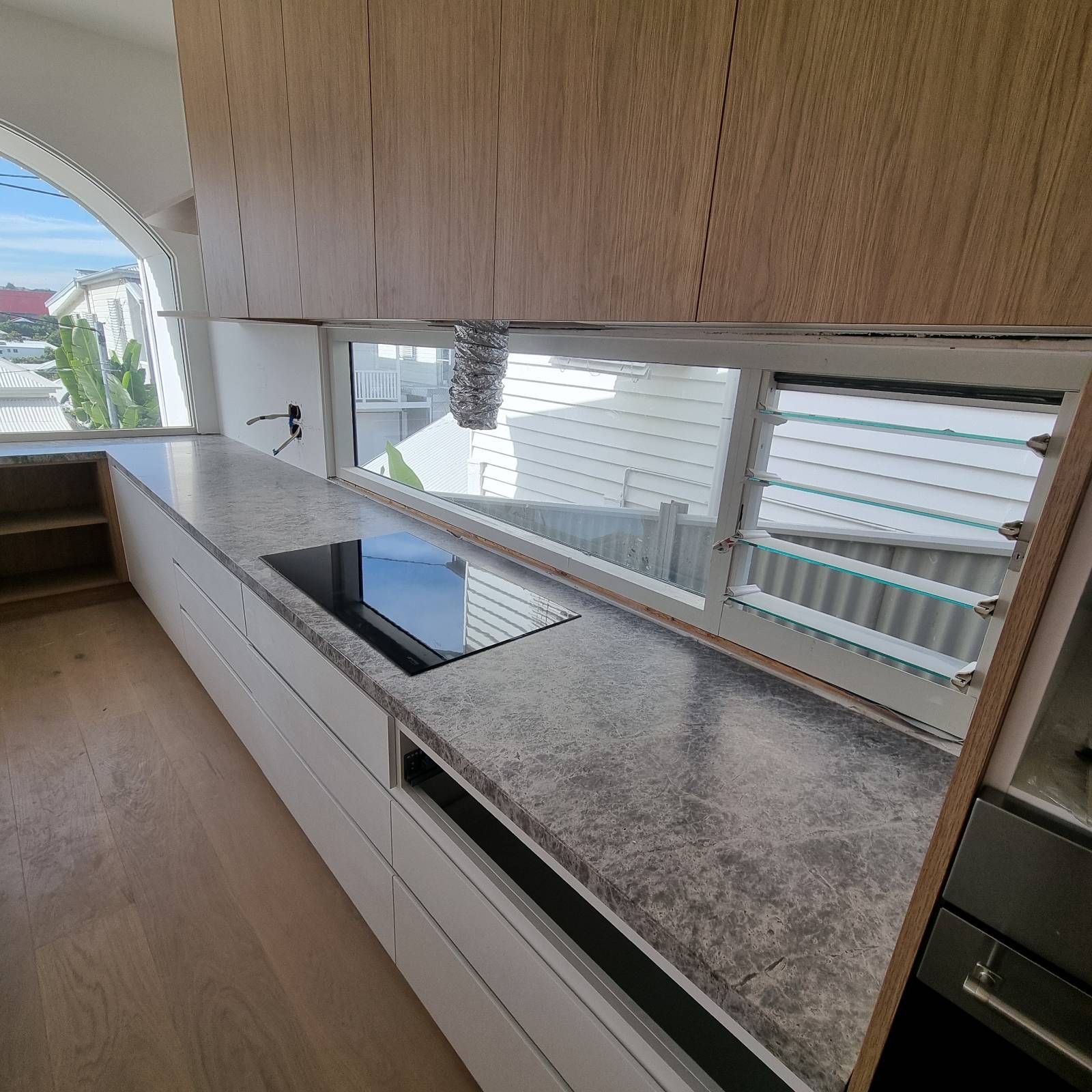 A large marble benchtop is being made in a new townhouse — Universal Marble & Granite In Woolgoolga, NSW