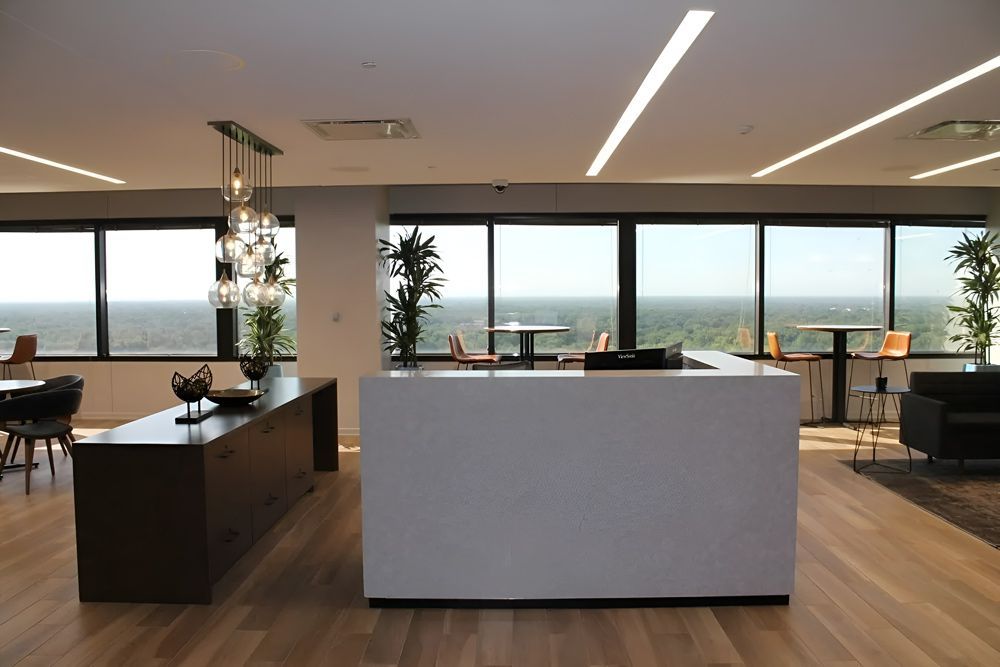 A Kitchen With A Large Island And Lots Of Windows — Universal Marble & Granite In Coffs Harbour, NSW