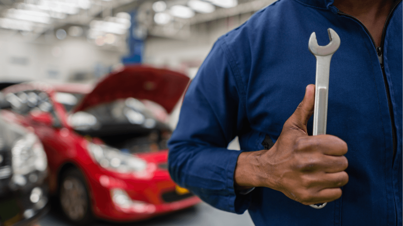 a mechanic holding a wrench
