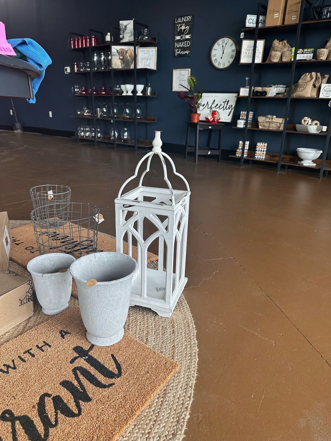 A woman is holding a red box with flowers in it.