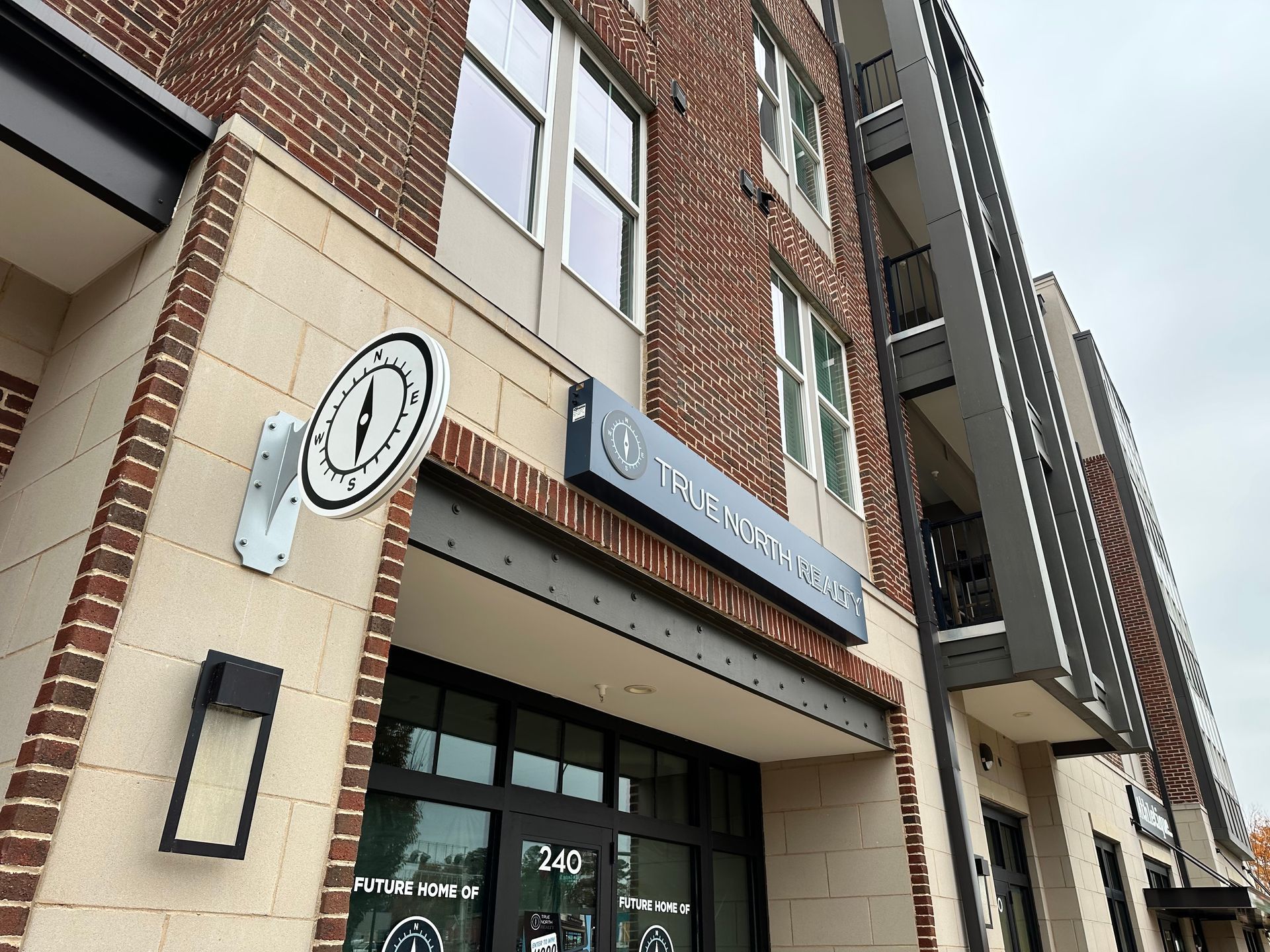 A brick building with a sign that says ' a ' on it