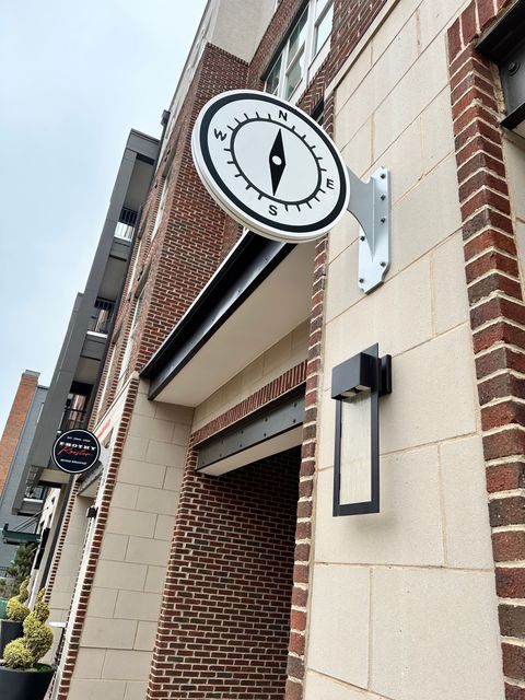 A clock on the side of a brick building