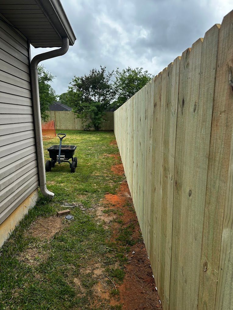 Wood privacy fence installed by Martin's Seamless Gutters & Fencing