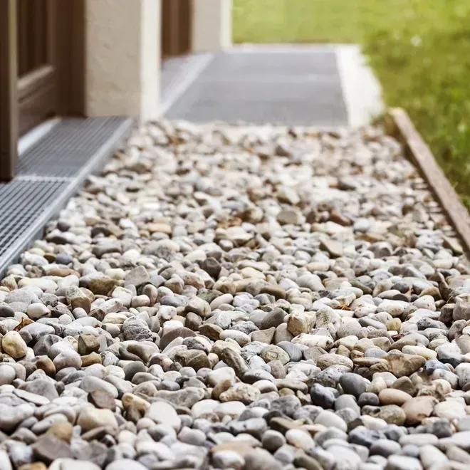 A large white house with a large porch and pillars