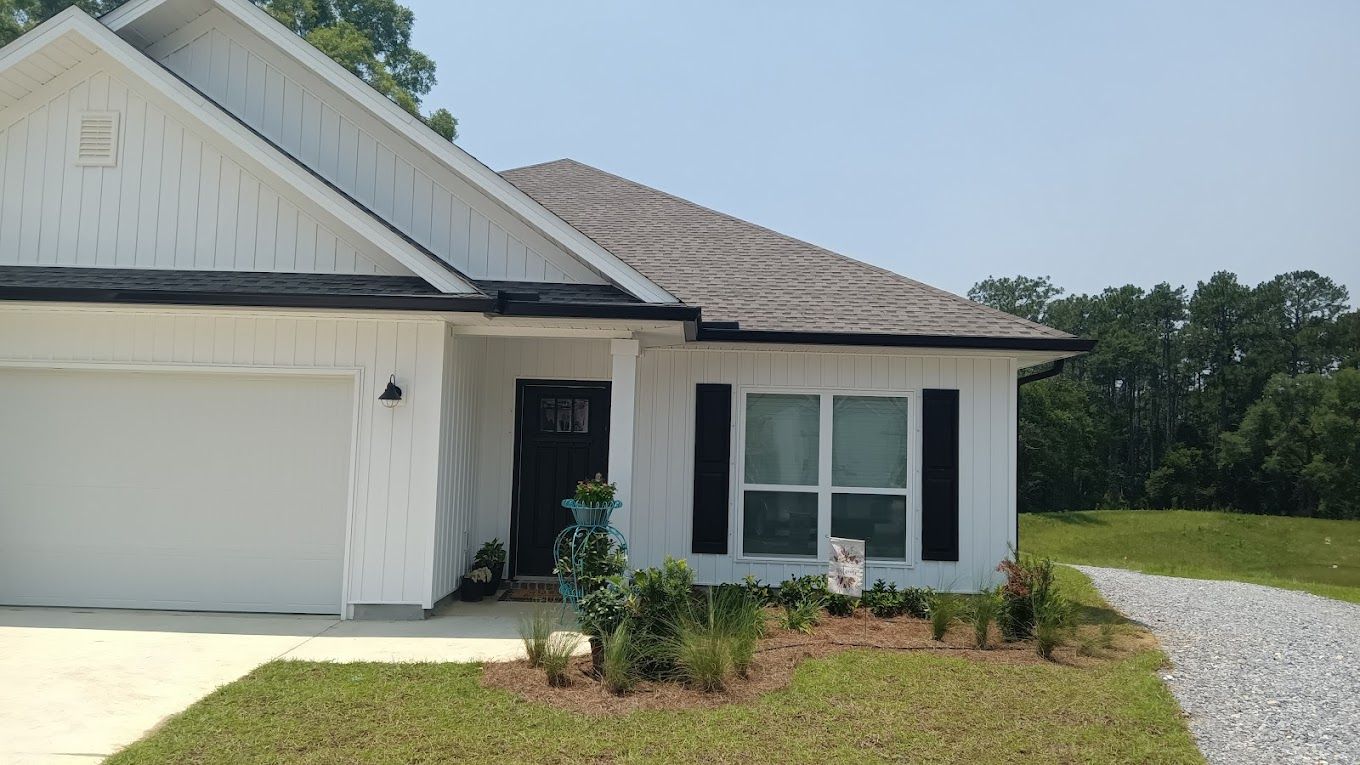 Black gutters installed by Martin's Seamless Gutters & Fencing
