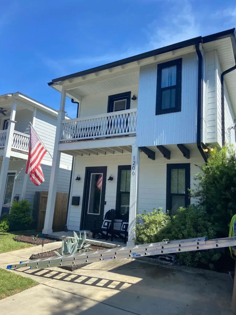 3×4″ Black Downspouts and Gutters on White House