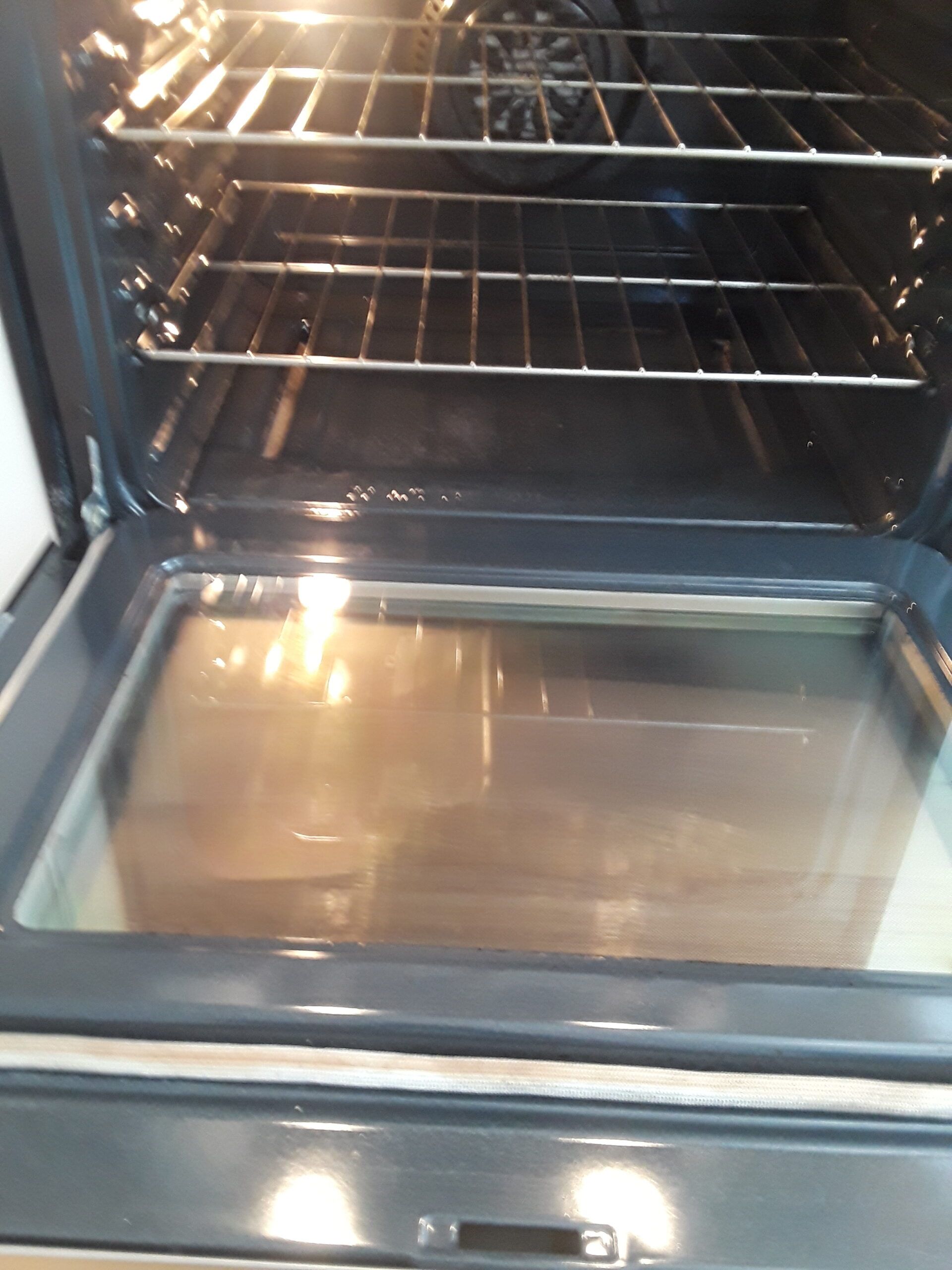 A close up of the inside of an oven with the door open.