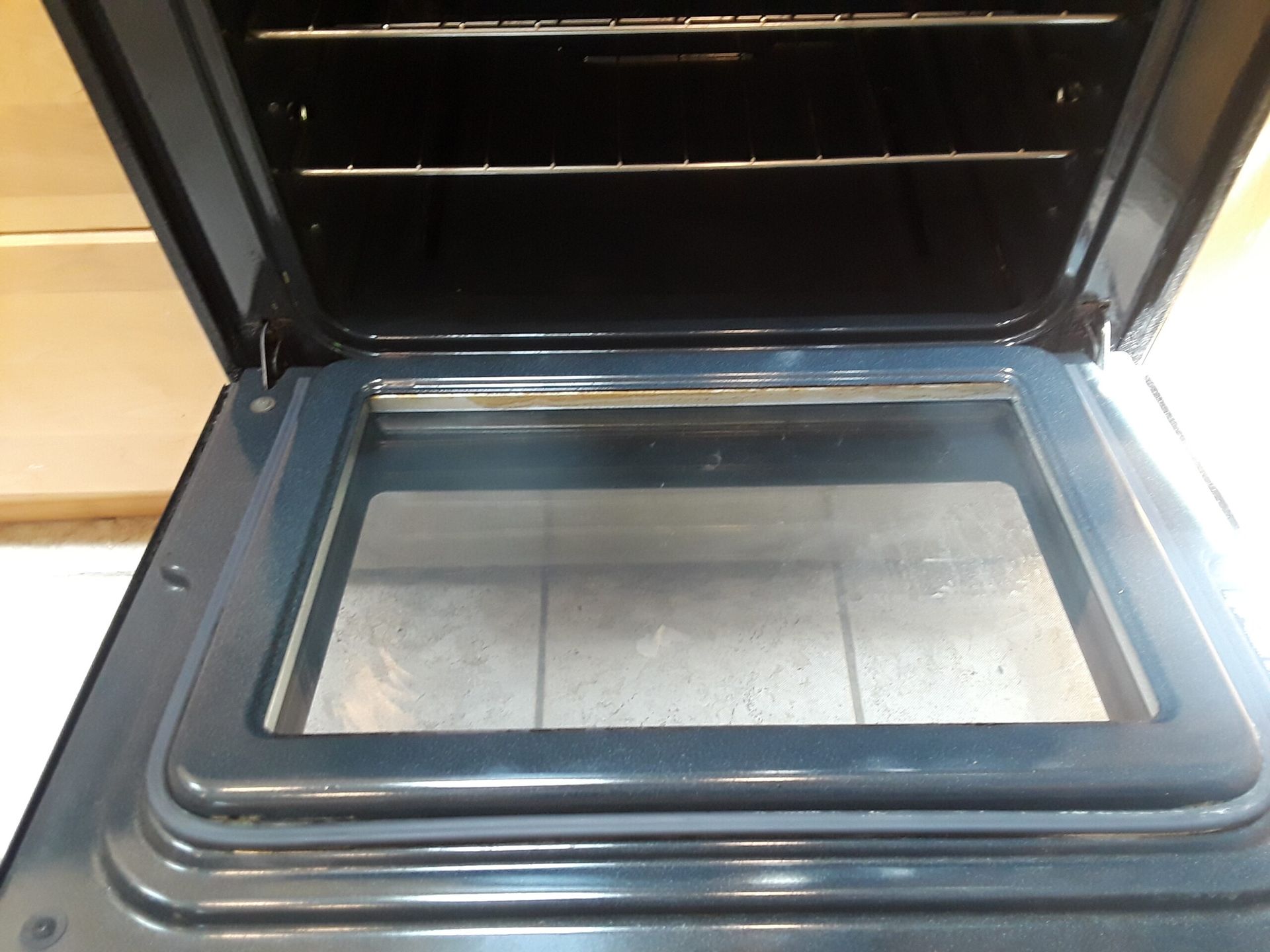 The inside of an oven with the door open