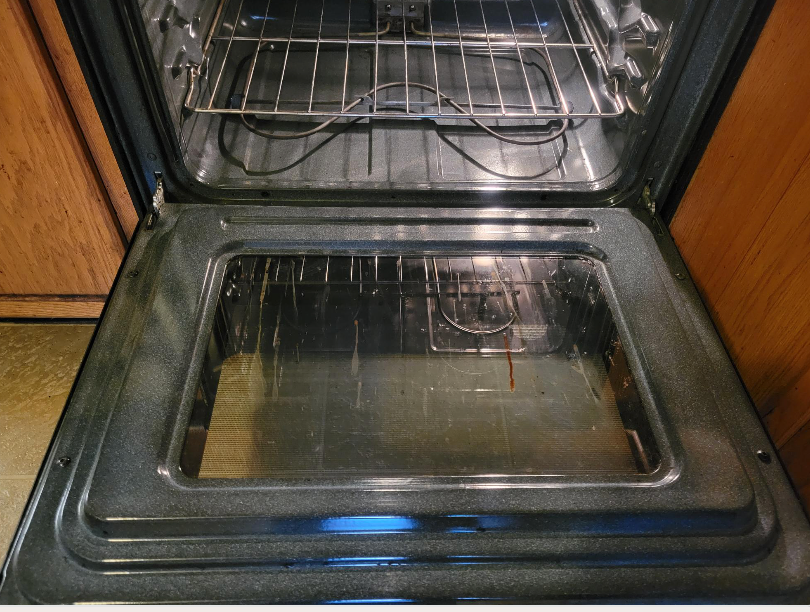The inside of an oven with the door open