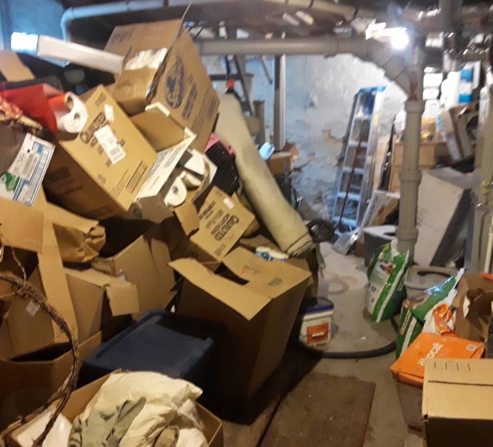 A bunch of cardboard boxes are stacked on top of each other