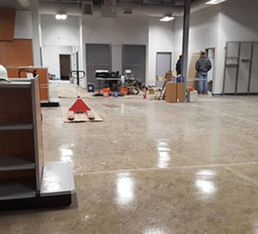 A large room with a pallet truck in the middle