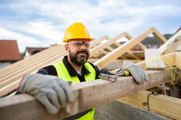 Roofing contractor talking to clients renovating their house.