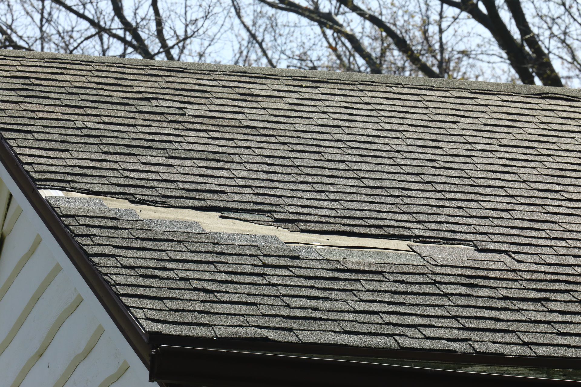 A damaged roof from inclement weather.
