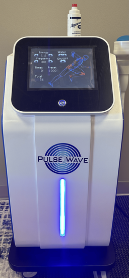 Extracorporeal Shockwave Therapy machine at Raise Chiropractic in Littleton, CO.