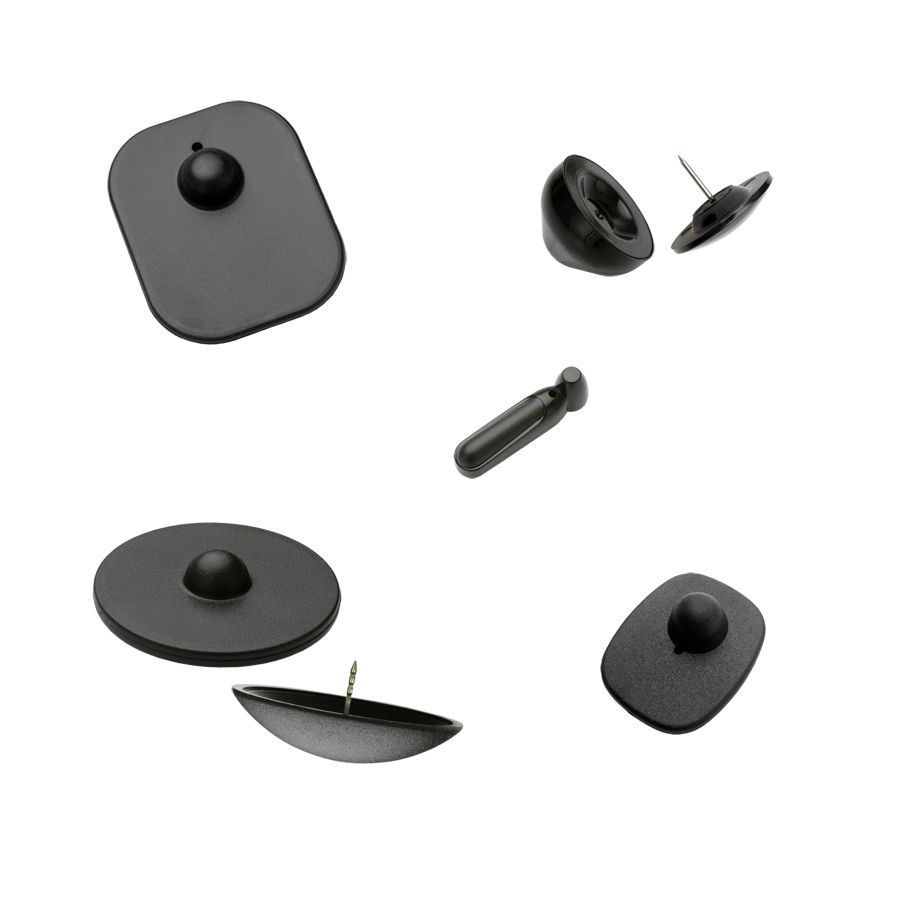 Pines de seguridad antirrobo de color negro, de uso común en tiendas minoristas y retail