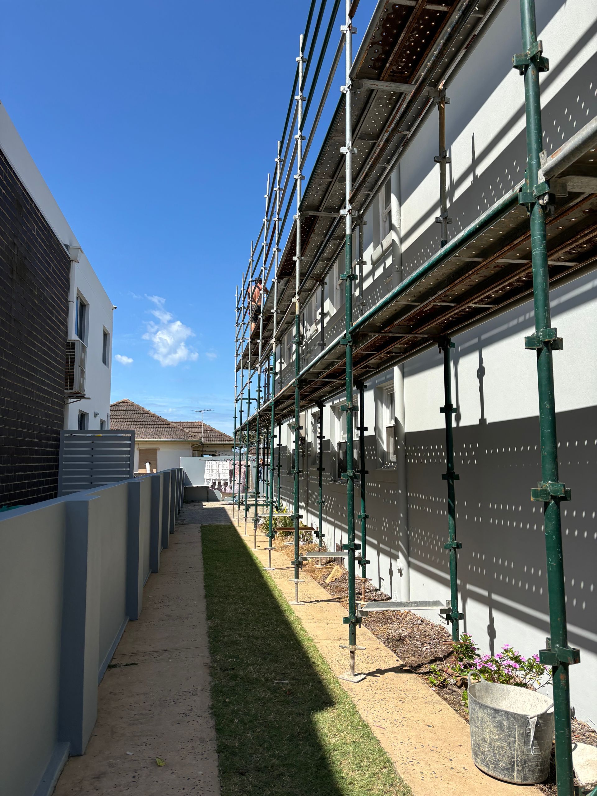 Kwikstage scaffold system installed along the side of a residential block for safe external wall access.