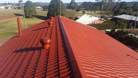 Worker Painting the Roof — Pressure Cleaning Services in Toowoomba, QLD