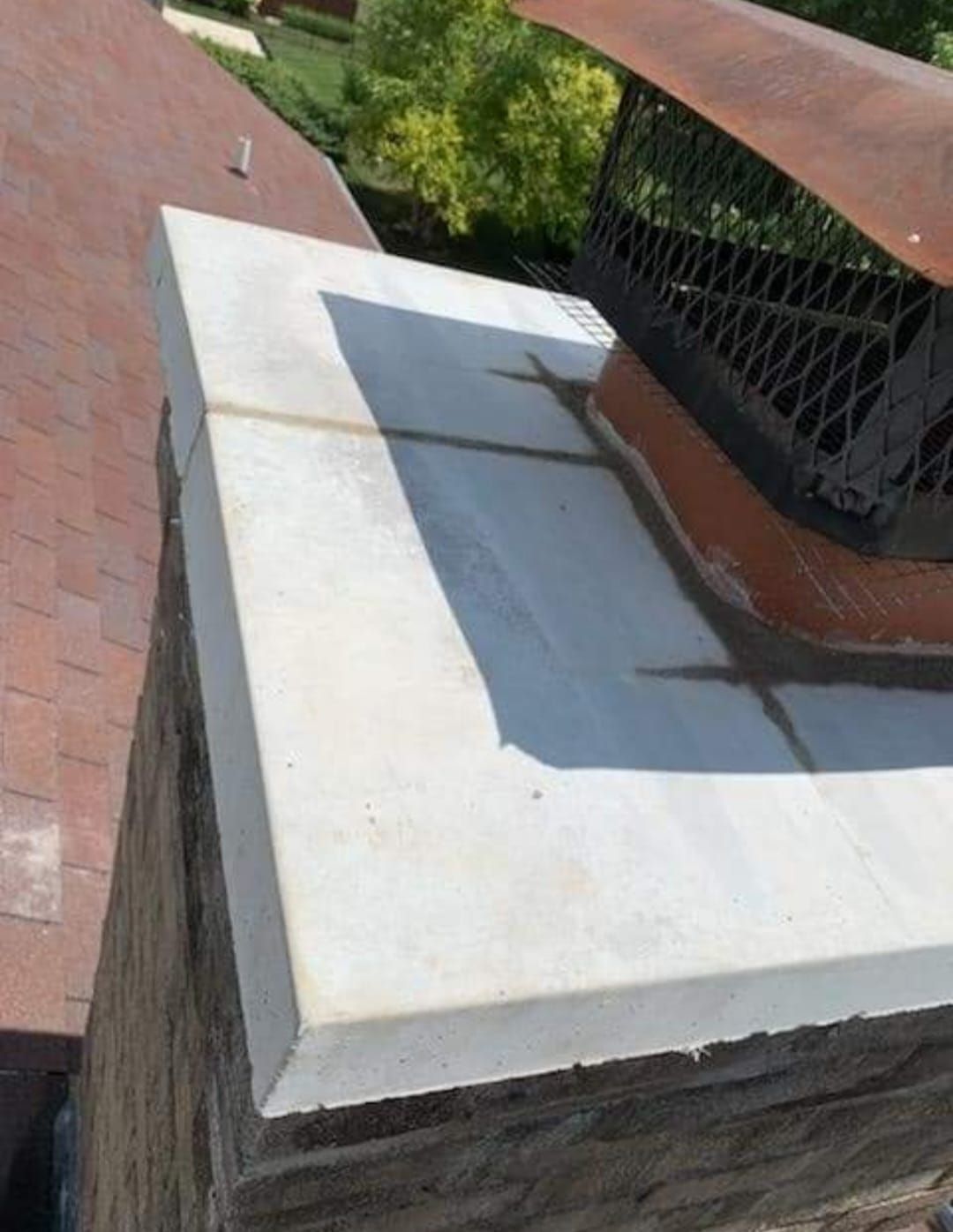 A chimney sitting on top of a brick roof