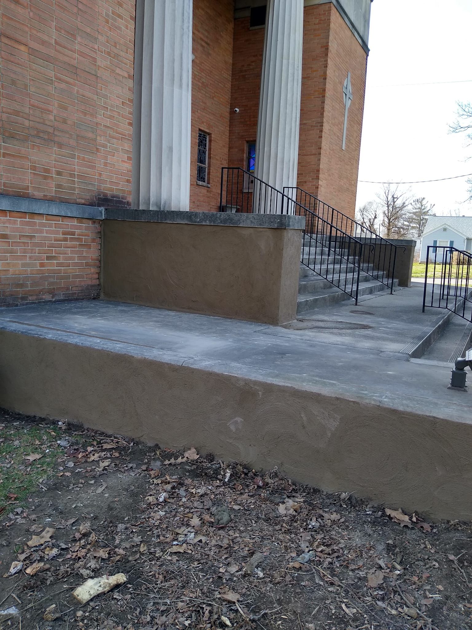 A brick building with stairs leading up to it.