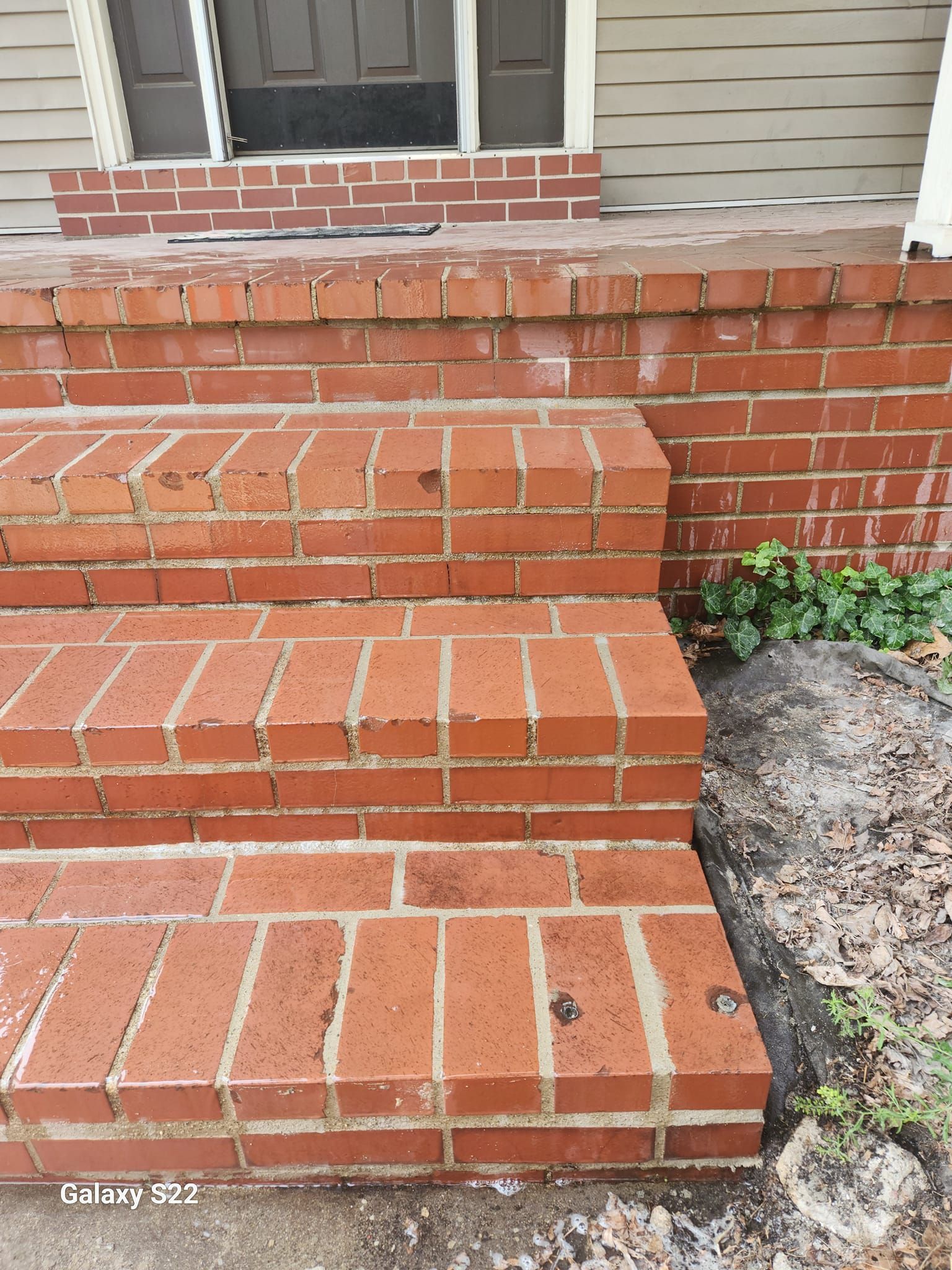 A set of brick steps leading up to a house.