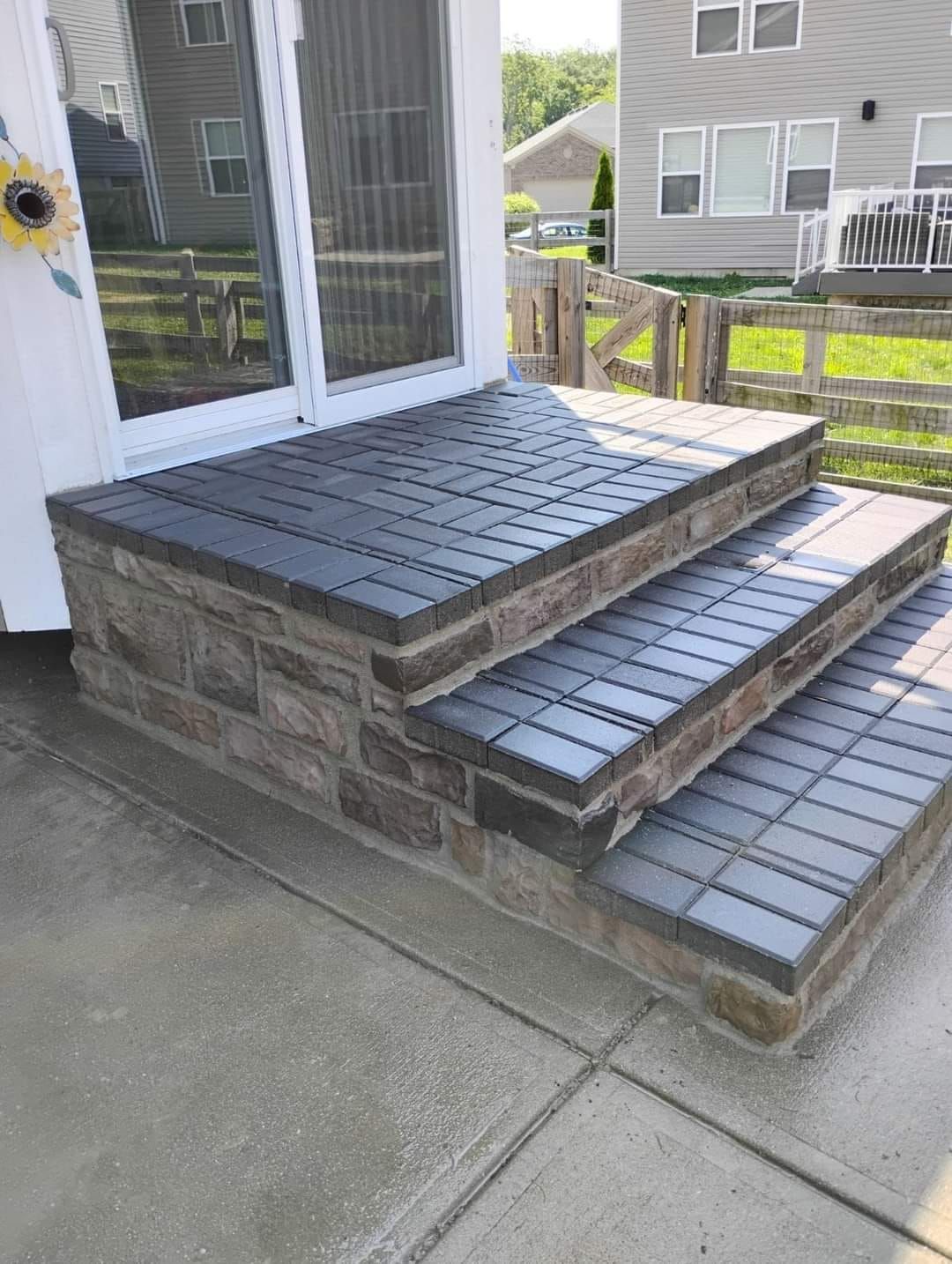 A set of brick steps leading up to a house.