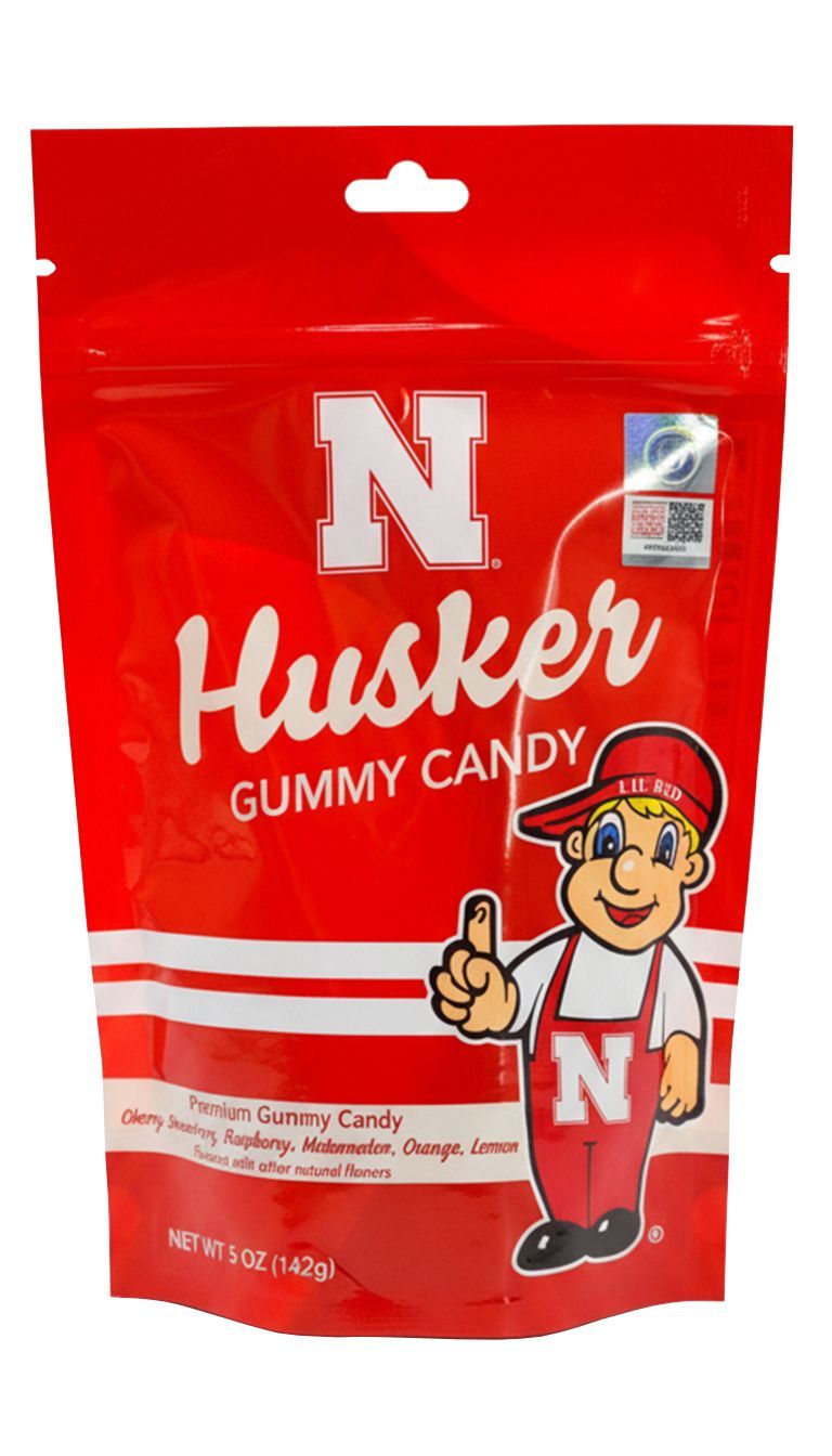 Red bag of Husker gummy candy with mascot giving thumbs up.