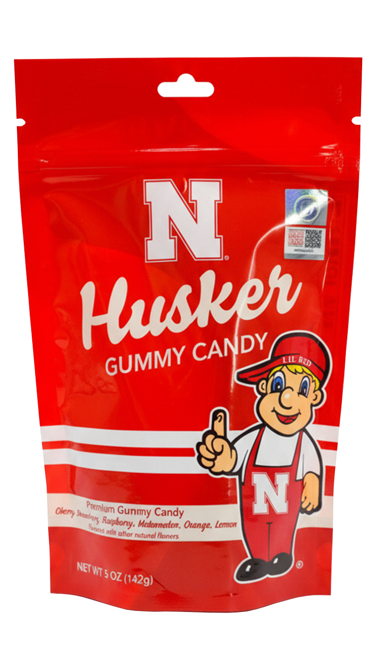 Red bag of Husker gummy candy with mascot giving thumbs up.