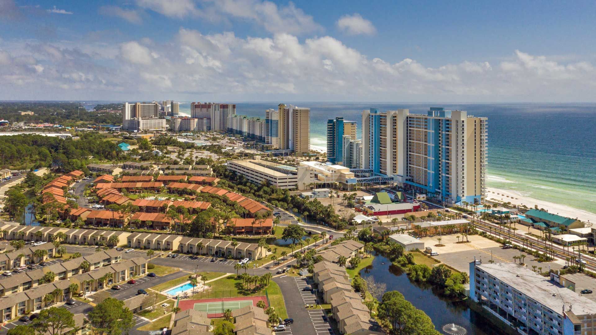 An aerial view of a city surrounded by water and buildings.