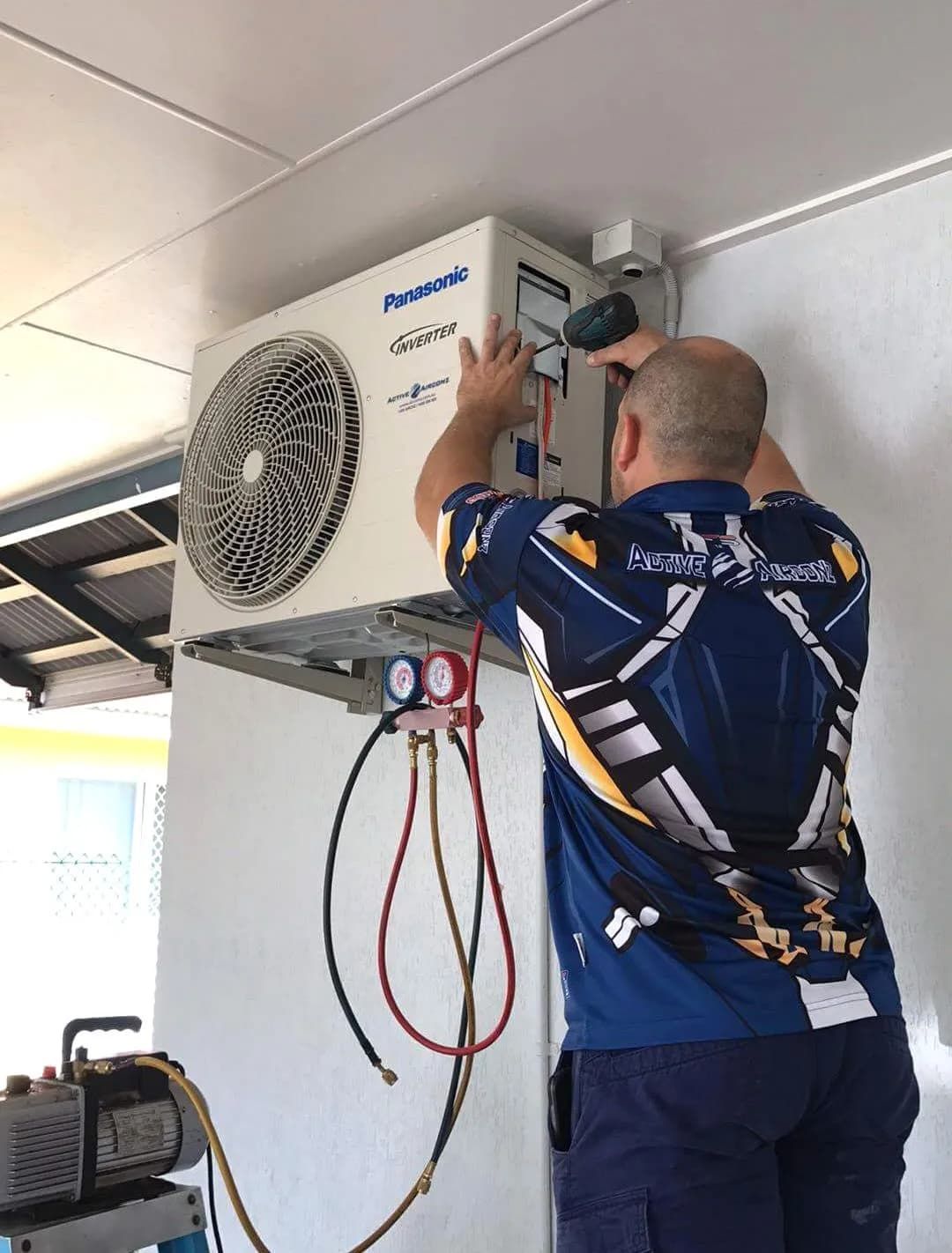 HVAC Technician Installing an Outdoor Air Conditioning — Active Airconz in Winnellie, NT