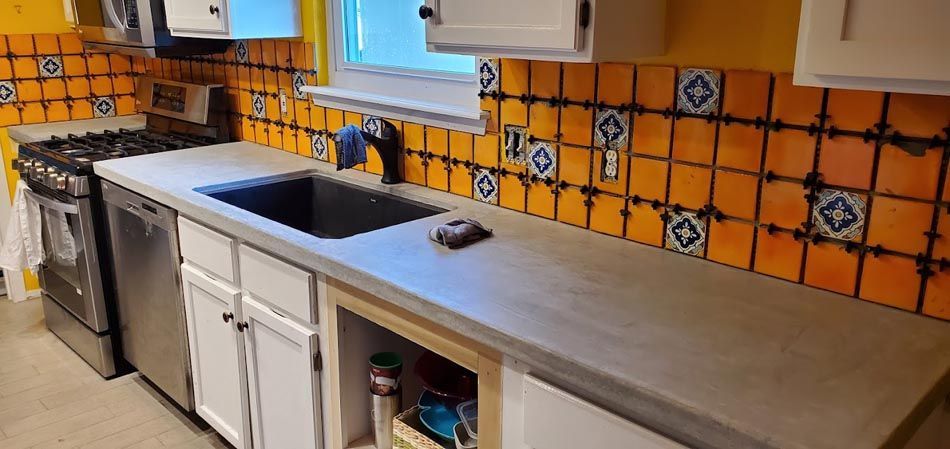 A Kitchen with A Sink, Stove, and Dishwasher