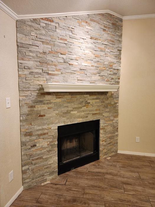 There Is a Fireplace in The Corner of The Room