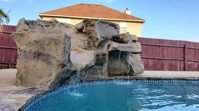 There Is a Waterfall in The Middle of A Swimming Pool