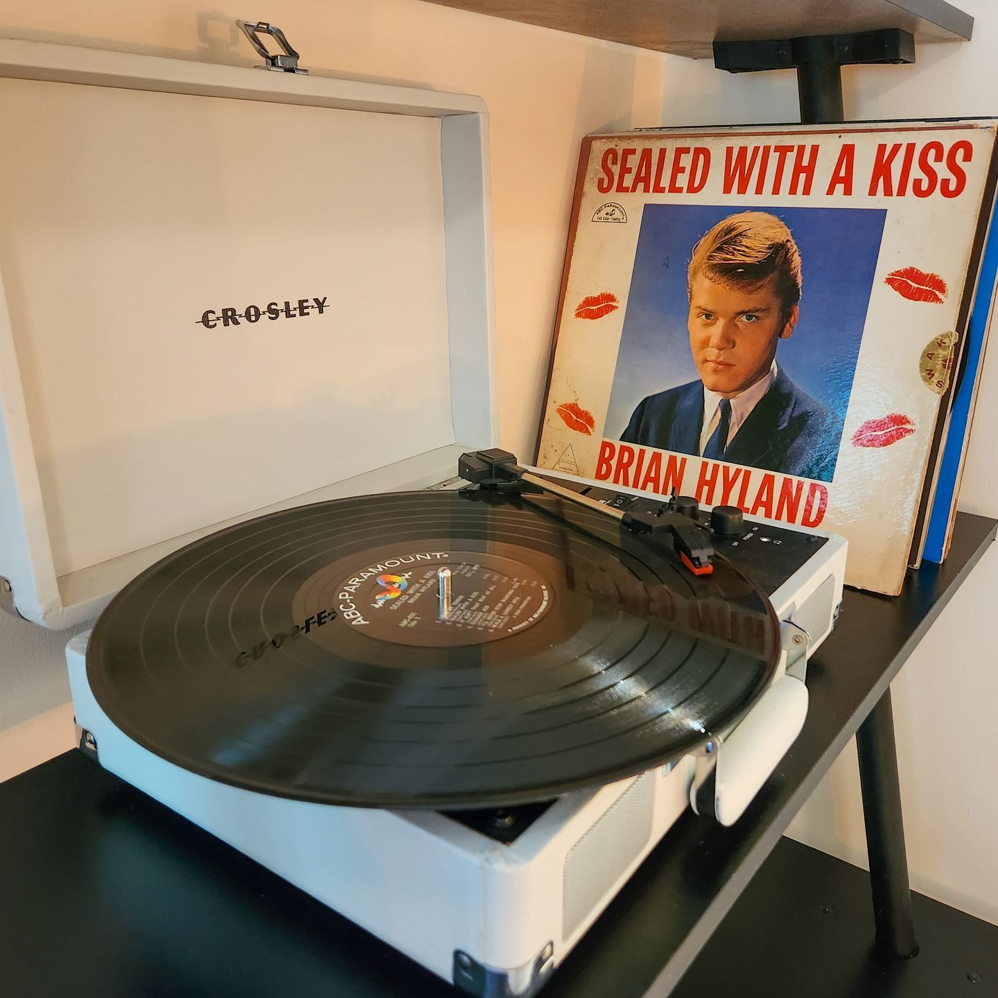 Closeup of one of Belleayre Lodge's cabin amenities: Crosley vintage-style turntable with a vinyl record inside.