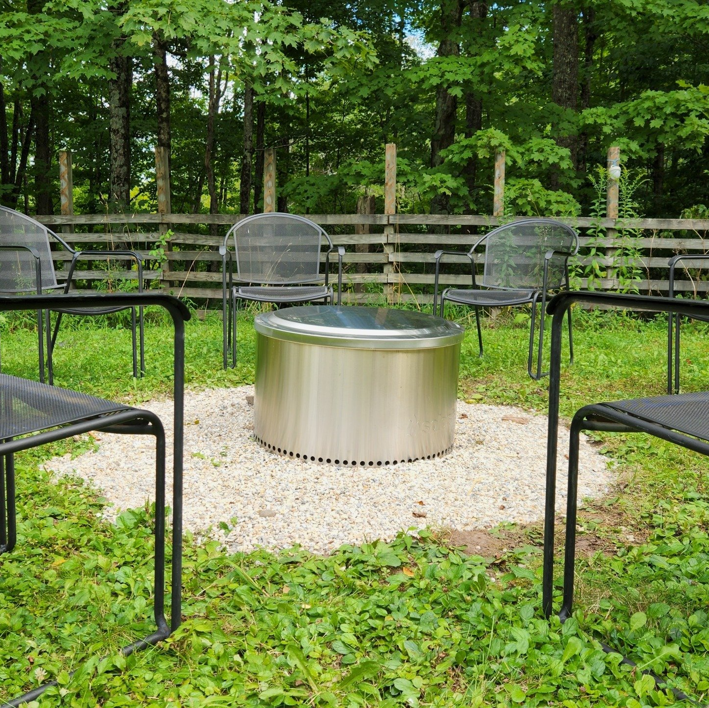 Chairs surrounding a metal figure outdoors at Belleayre Lodge.