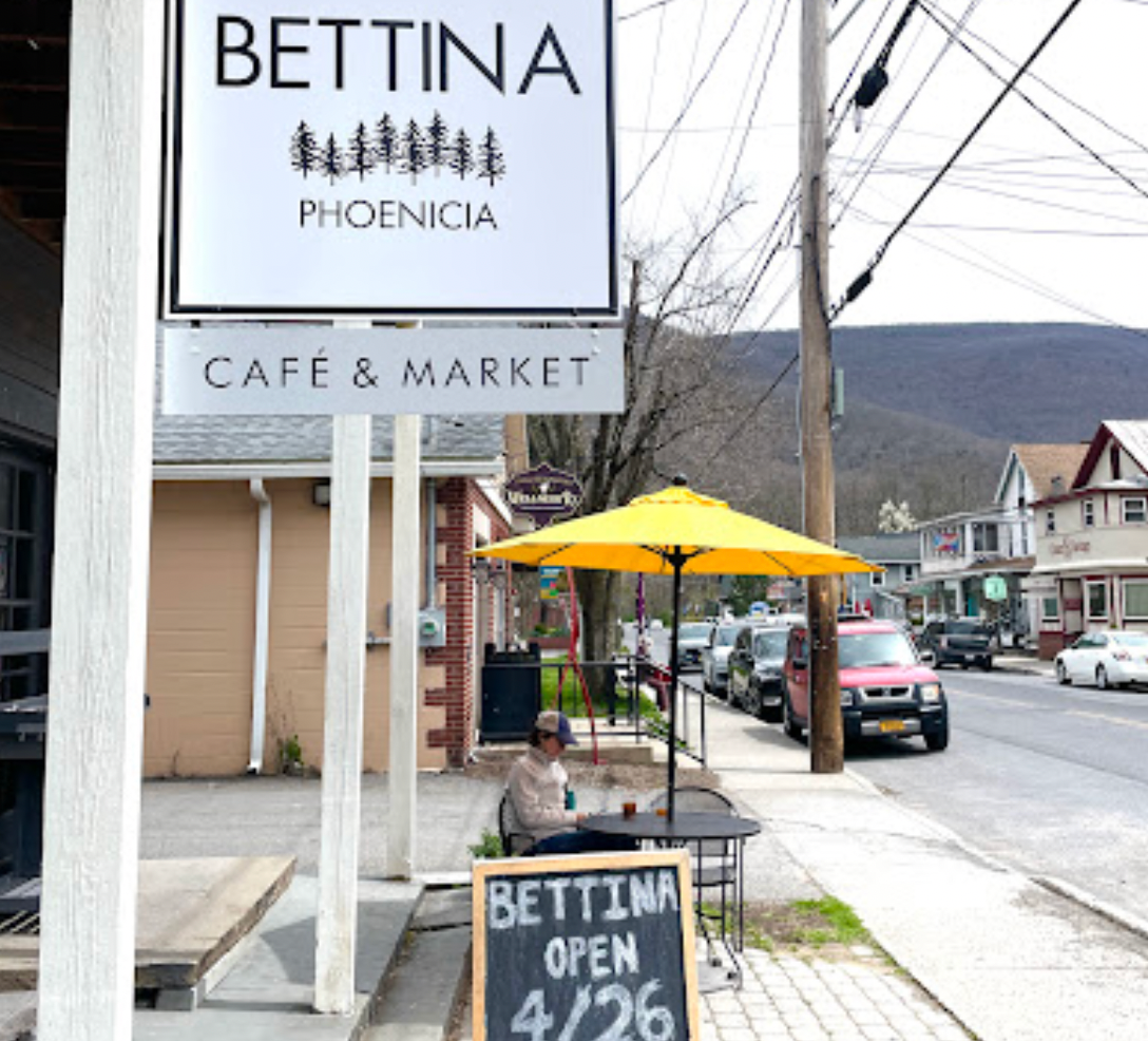 Exterior of Phoenicia Cafe and Market in Pine Hill New York, with a quaint side street.