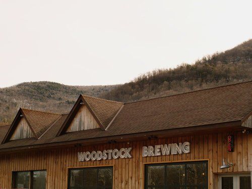 Image of Woodstock Brewing Company with Catskill mountain views in background.