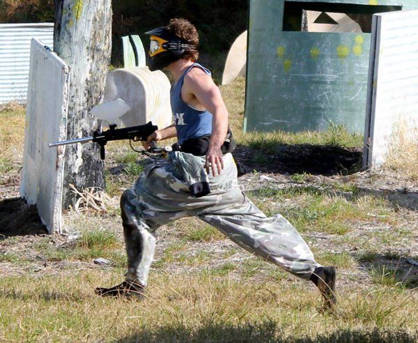 paintball player running across field