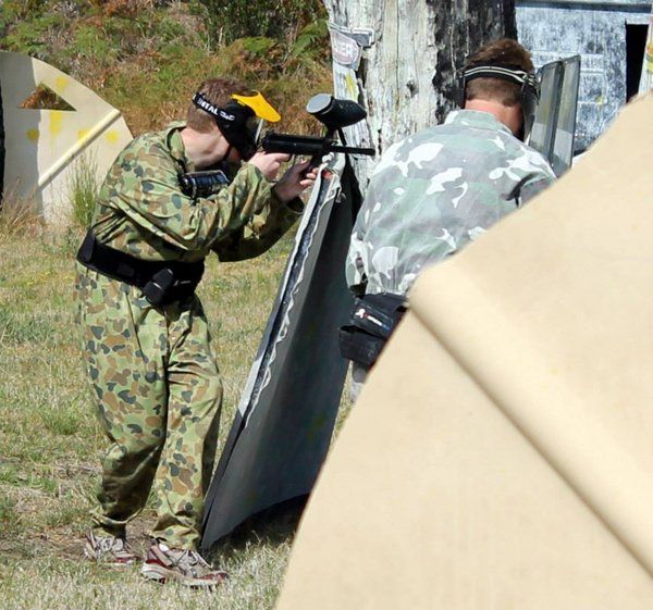 paintball player behind cover