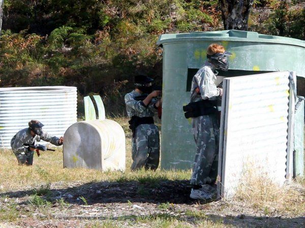 paintball players behind cover