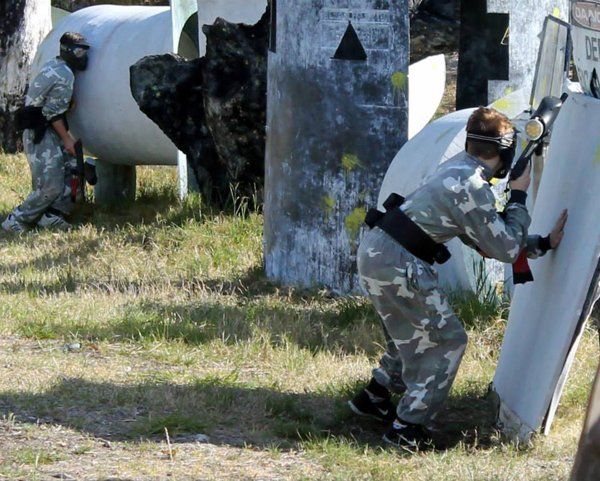 paintball game and players