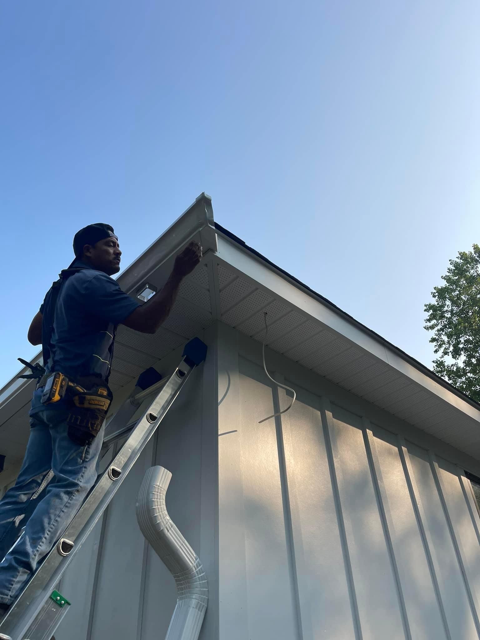 Worker Installing New Gutter — Charlotte, NC — Wade H Helms Guttering