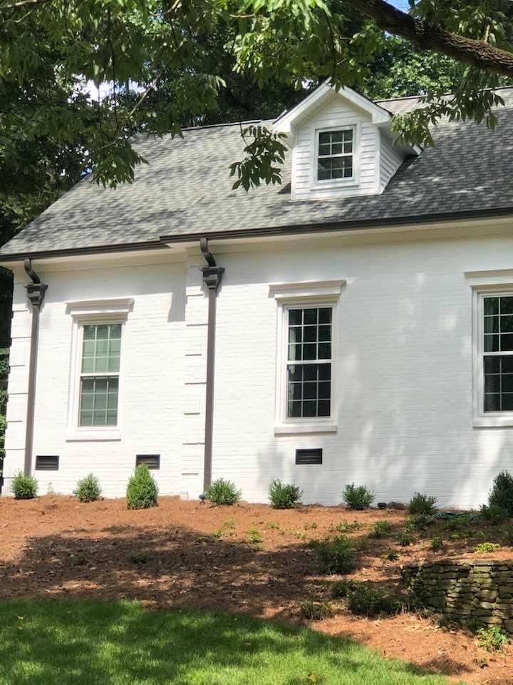 Dark Pipes On White Wall — Charlotte, NC — Wade H Helms Guttering